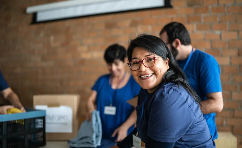 This nonprofit volunteer is working at a donation center after responding to a nonprofit call to action.