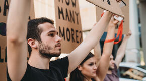 This photo of a group of people participating in a social protest shows an advocacy effort, which can be powered by digital advocacy forms.