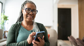 Portrait of a senior woman using a mobile phone at home