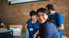 Portrait of a volunteer working in a community charity donation center