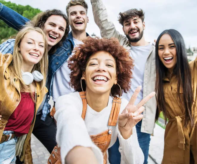 Group of happy friends taking selfie pic outside - Happy different young people having fun walking in city center - Youth lifestyle concept with guys and girls enjoying day out together