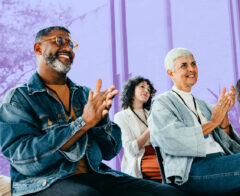 A group of donors and other supporters at a nonprofit event.