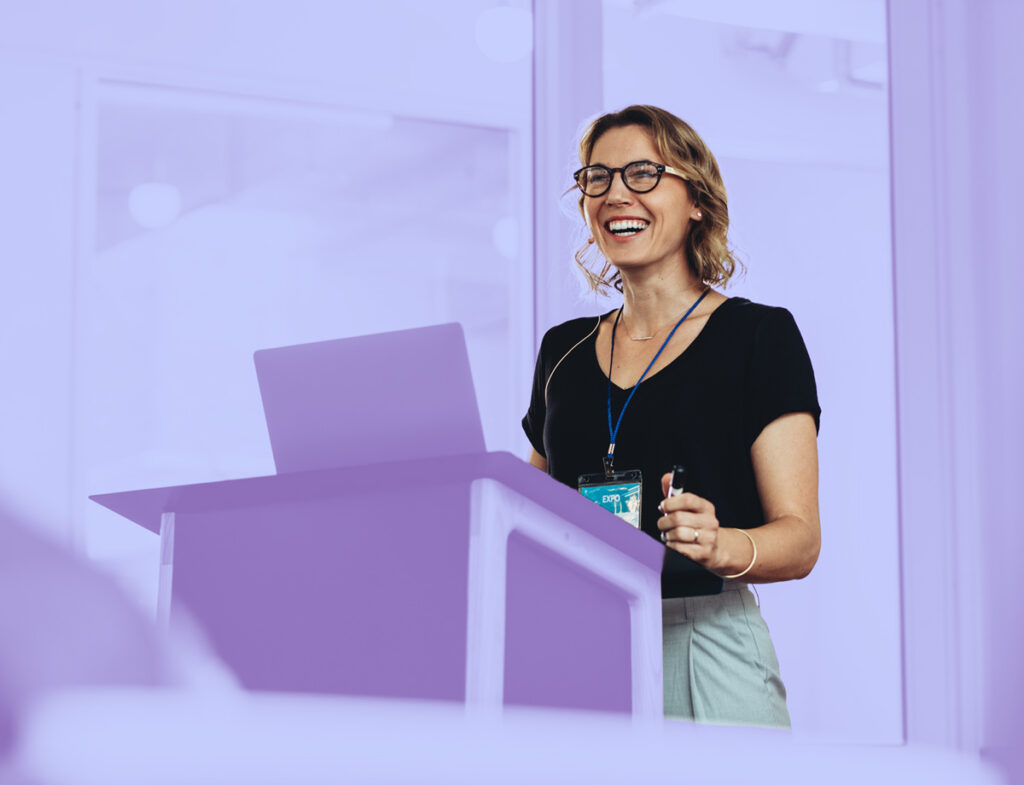 A picture of a nonprofit representative presenting their organization’s impact report.