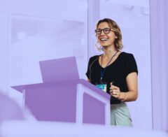 A picture of a nonprofit representative presenting their organization’s impact report.