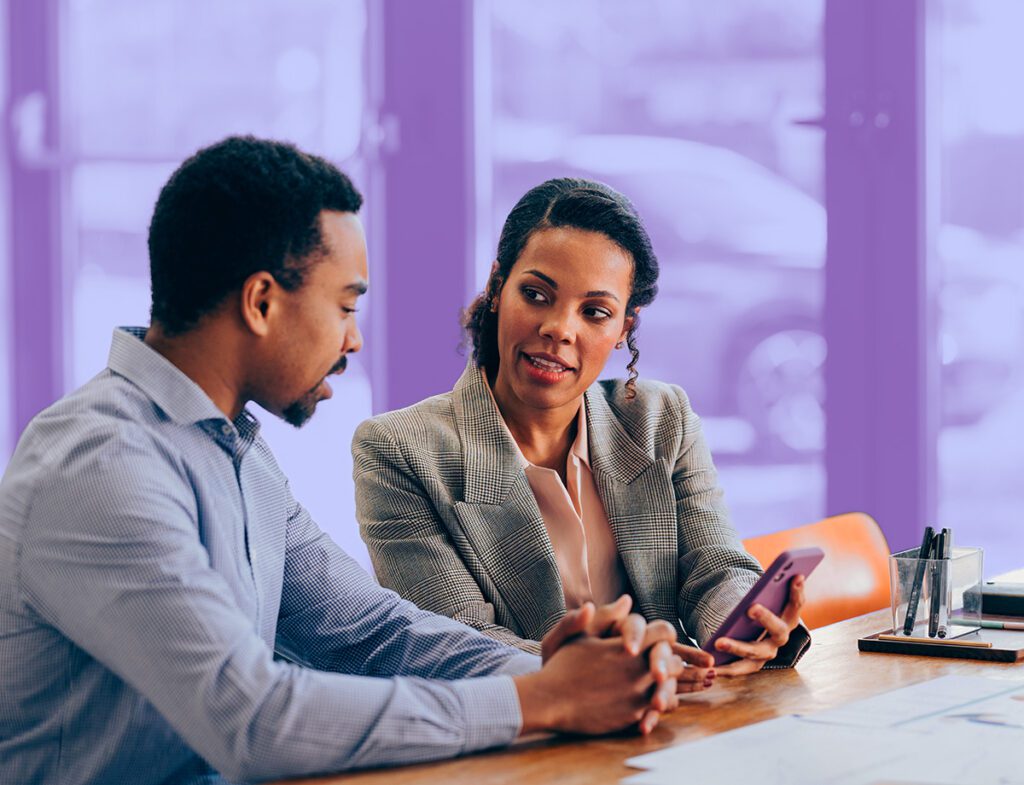 A person meeting with a financial advisor to discuss planned giving options.