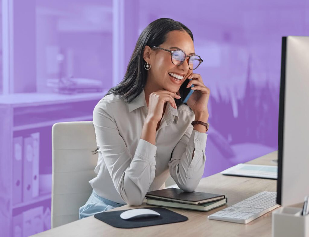 A photo of someone speaking with someone over the phone excitedly.