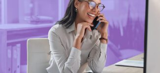 A photo of someone speaking with someone over the phone excitedly.