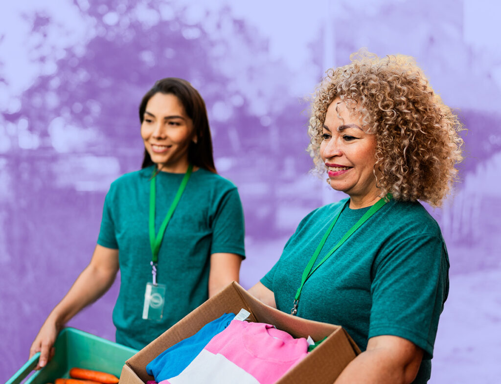 A picture of two people volunteering for a nonprofit.