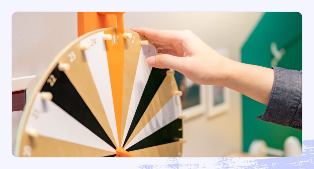 A photo of someone spinning a prize wheel.