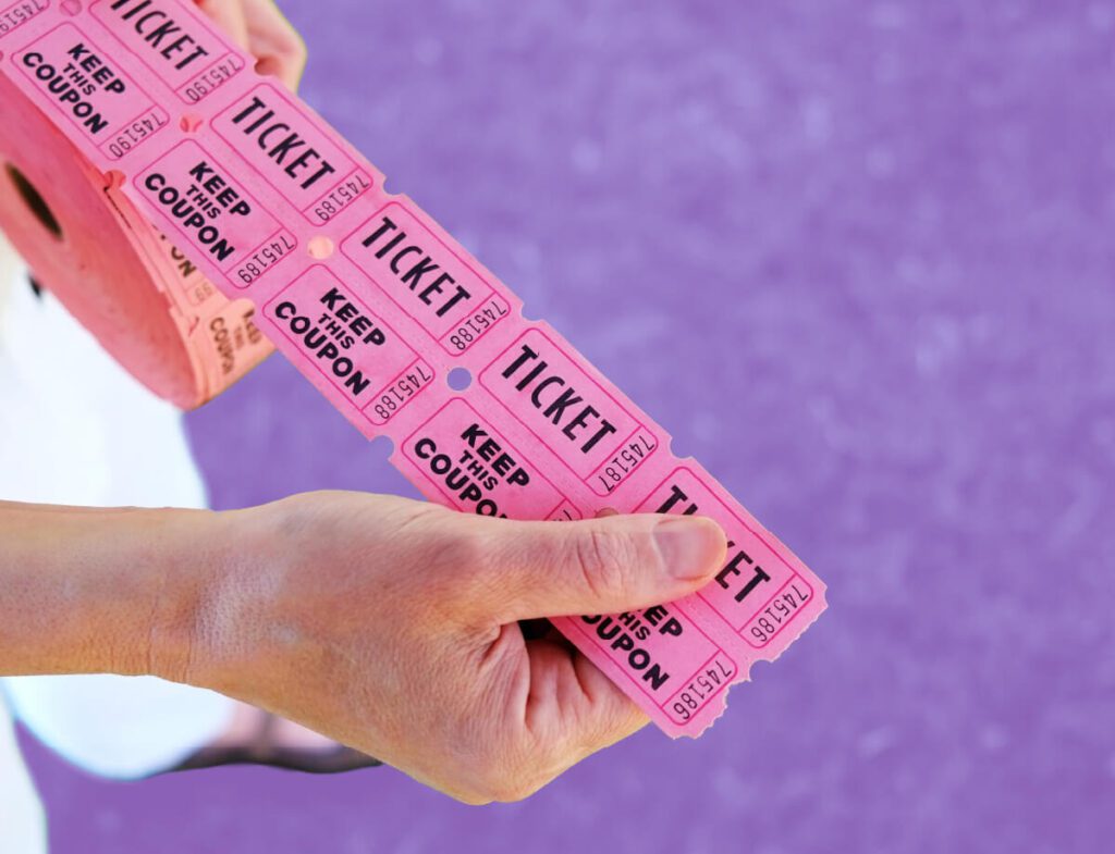 A photo of someone holding raffle tickets.