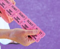 A photo of someone holding raffle tickets.