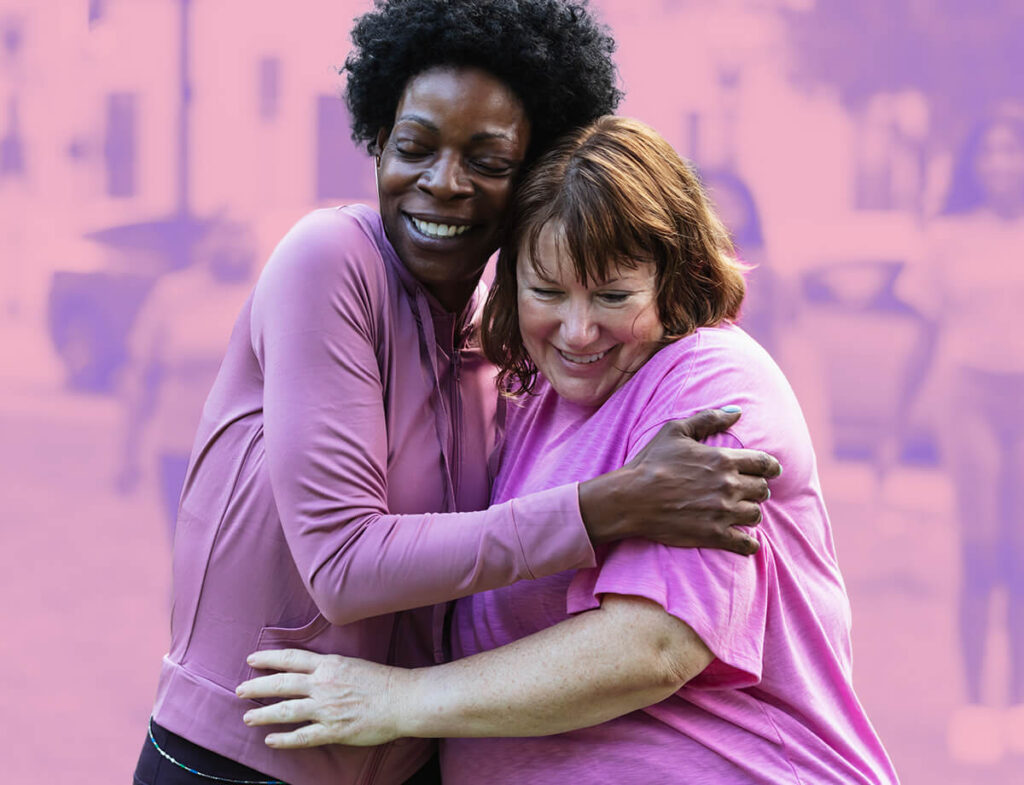 Two individuals embracing while participating in a fundraiser.