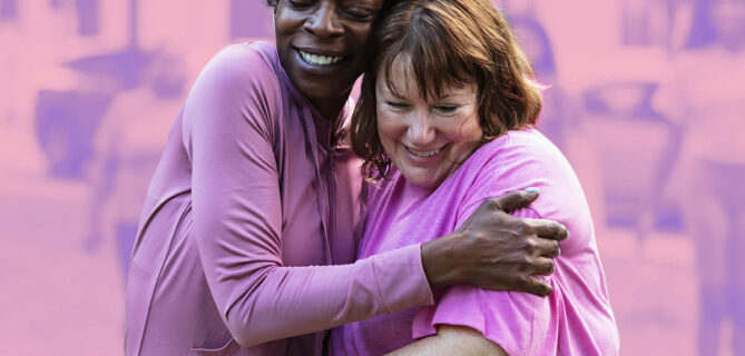 Two individuals embracing while participating in a fundraiser.