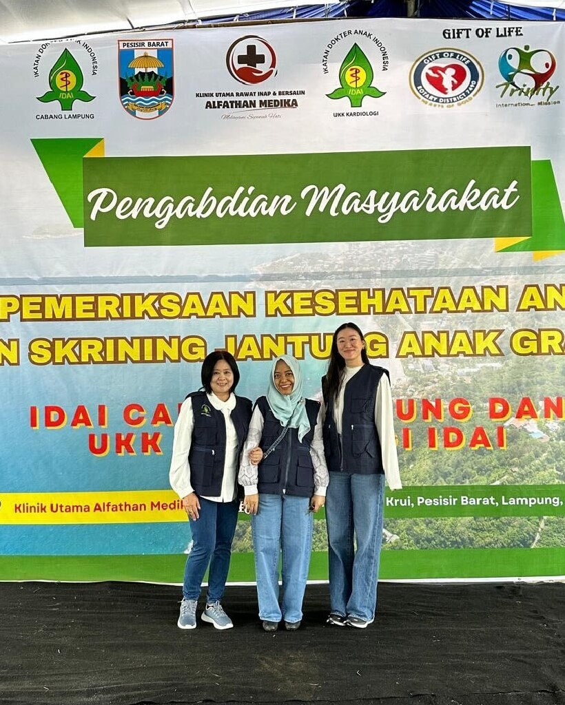 Cassandra stands with fellow volunteers in front of a health outreach banner in Lampung, Indonesia, demonstrating her commitment to community service and Bonterra’s values of social impact and empowerment.